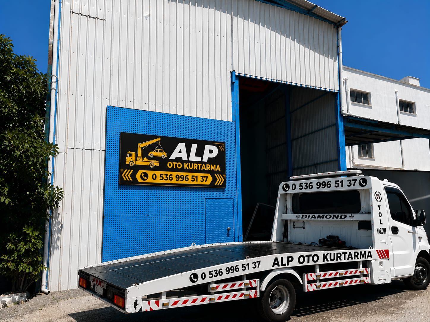 Alp Oto Kurtarma çekici aracı ve dükkan tabelası